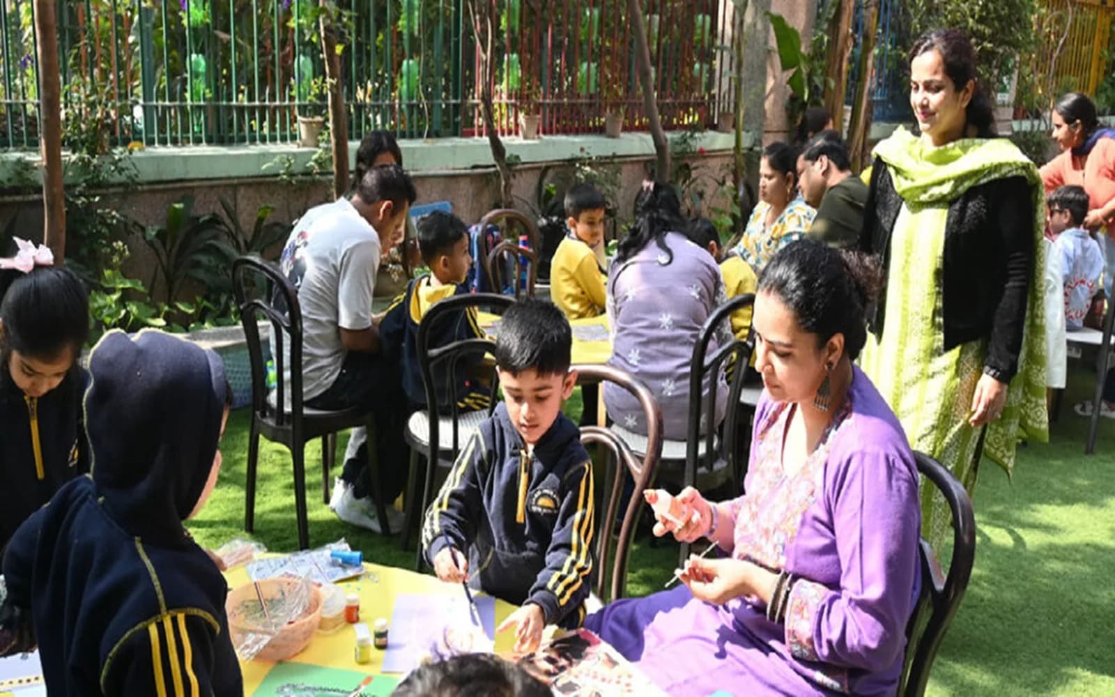 Families and teachers spending time together at a school community programme