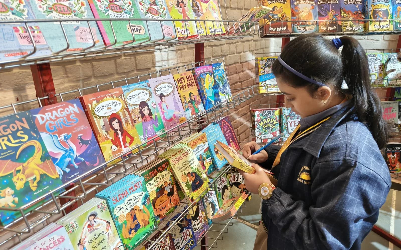 A student exploring books in the school library