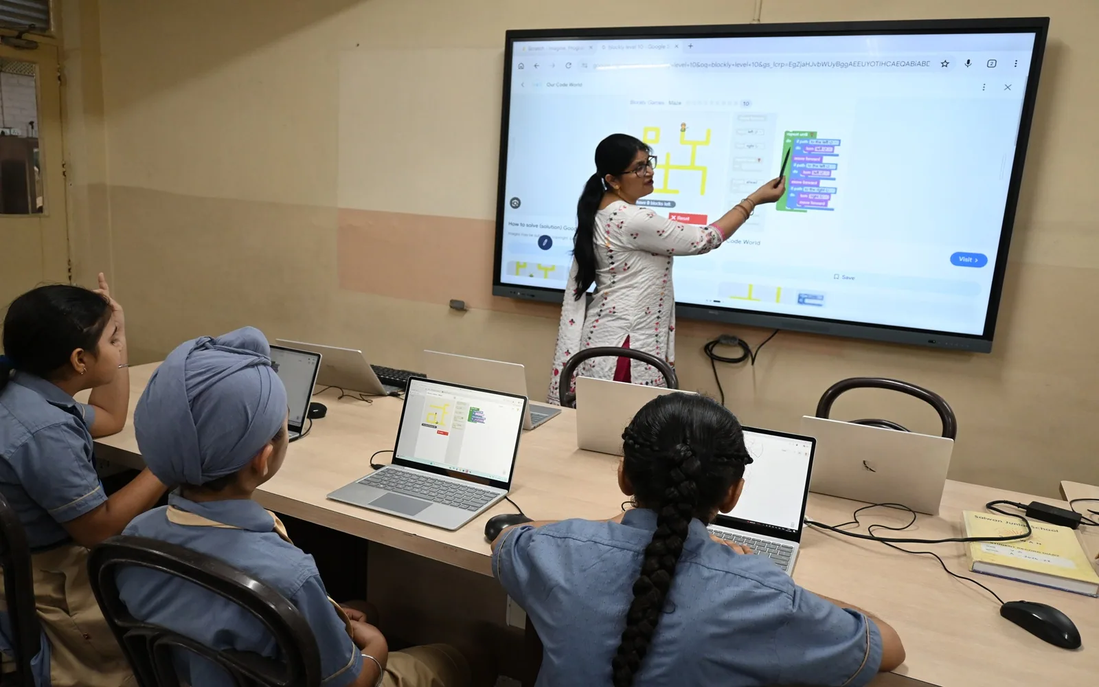 Students working with laptops during a planned digital learning session